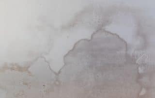 Damage caused by water leakage on a ceiling