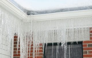 Icicles hanging off roof of a home